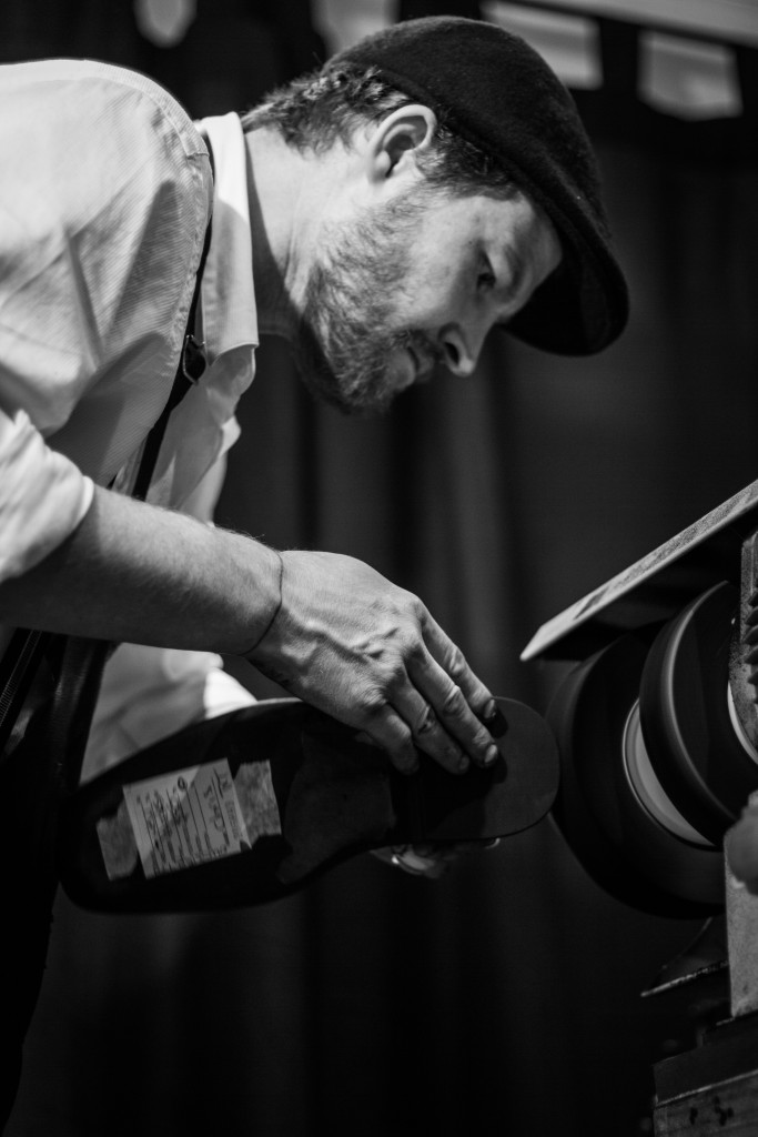 Luke at work buffing a shoe...my shoe incidentally.